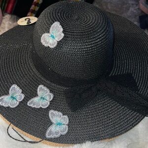 Floppy hat embellished with butterflies patches
